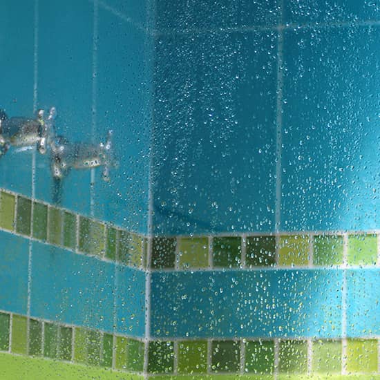 shower glass with water droplets on it