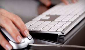 Hands use a computer mouse