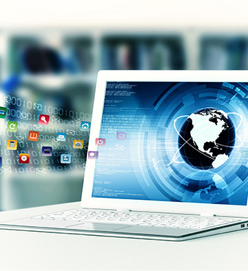 A laptop with various logos flying off the screen