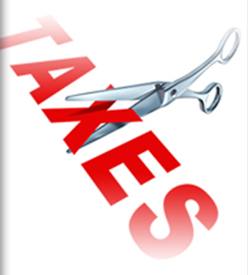 scissors cutting the word taxes