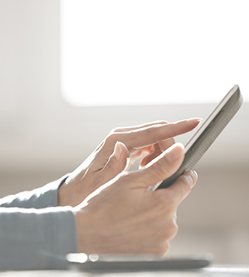 A person holding a digital device