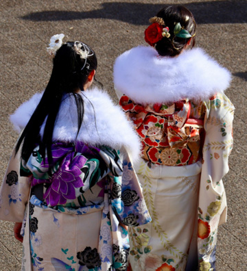 Back view of two students in traditional Navajo attire