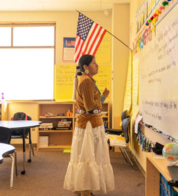 Teacher working with her students in the classroom
