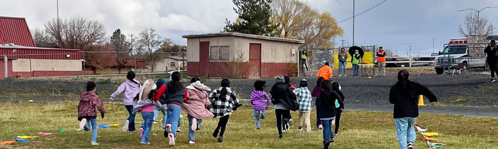 Students running on the school campus during the annual Turkey Trot