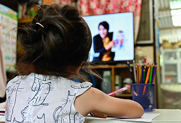 Close up of a schoolgirl learning online