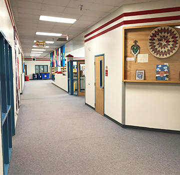 School hallway displaying Navajo (Diné) artifacts