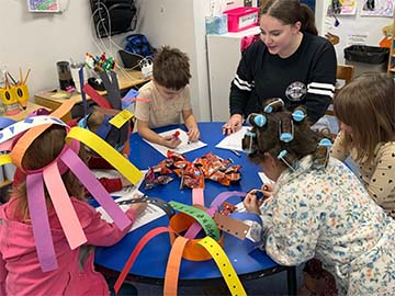 Students working with silly hats