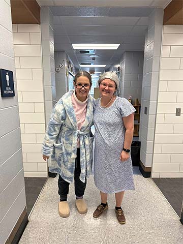 Two staff dressed as old ladies