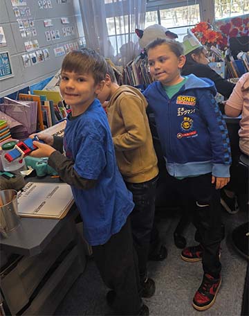 Three students smiling