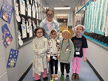 staff member and four students dressed as old people