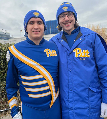 Two students in Pitt Band uniforms