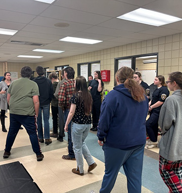 Students and adults in a hallway
