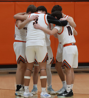 Students in a huddle during basketball game