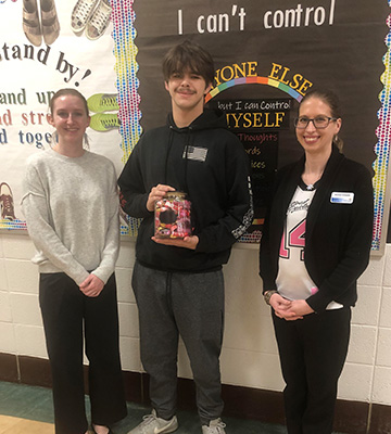 Three students in the school hallway