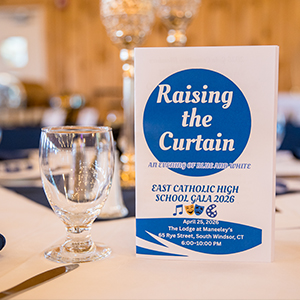 Close up view of gala table with Raising the Curtain brochure