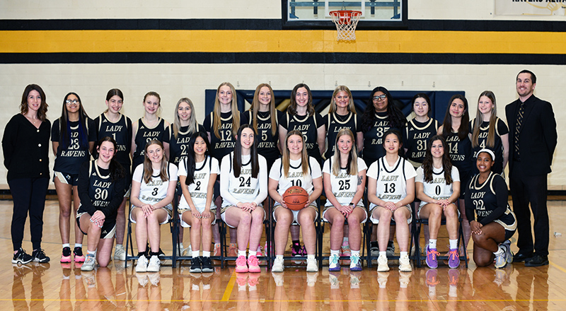 Lady Ravens girls basketball team with coaches