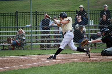 Maur baseball player hitting a ball