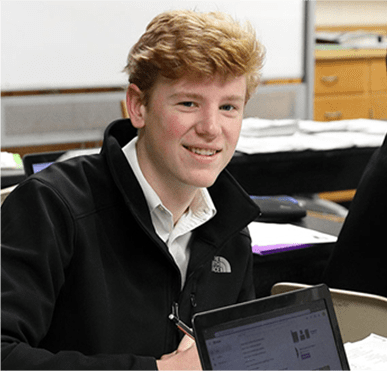 Maur student sitting at a desk
