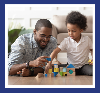 dad and child playing blocks