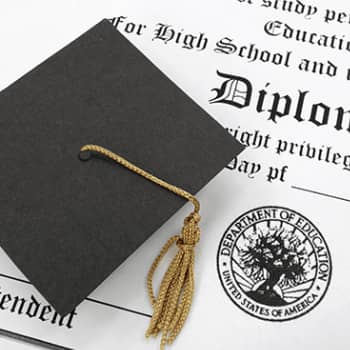 graduation cap with a diploma