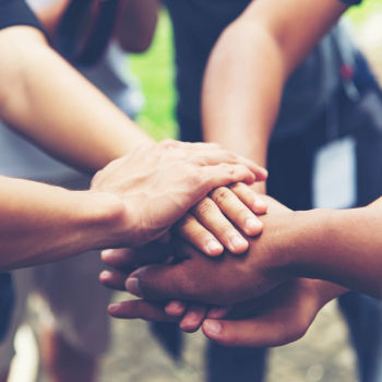 circle of people with hands in