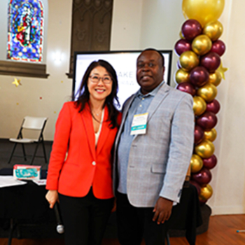 FACE representative in red blazer next to NDCS administrator