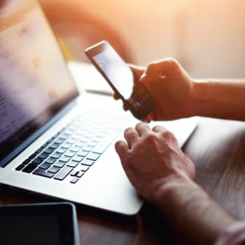 computer on desk with apple