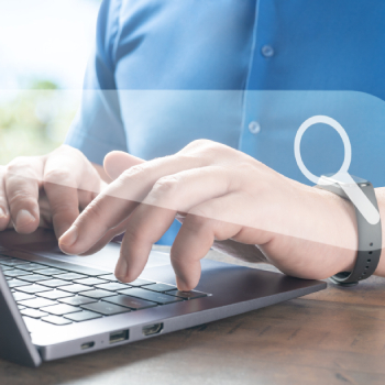man typing on laptop