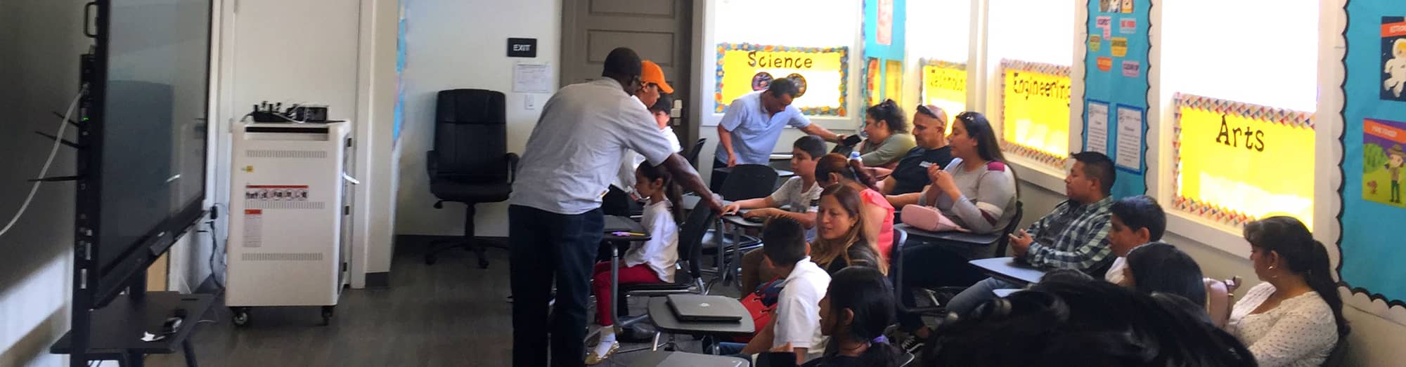 parents and students in a classroom
