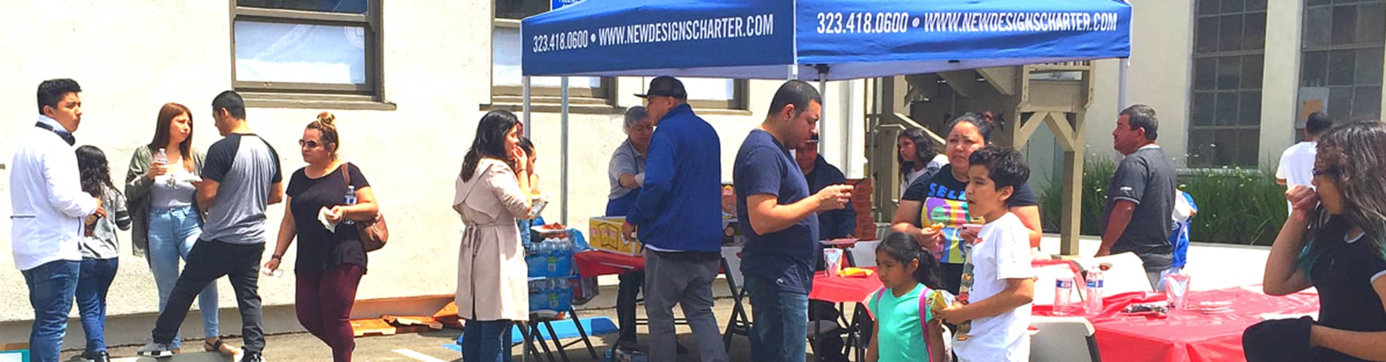 parents, students and staff members at an outside event