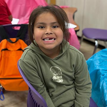 Girl smiling in class Girl smiling in class