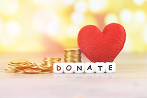 Donate on cubes next to red heart and coins