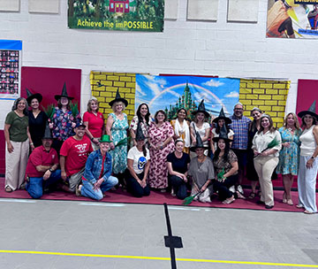 Staff member group photo in witch hats