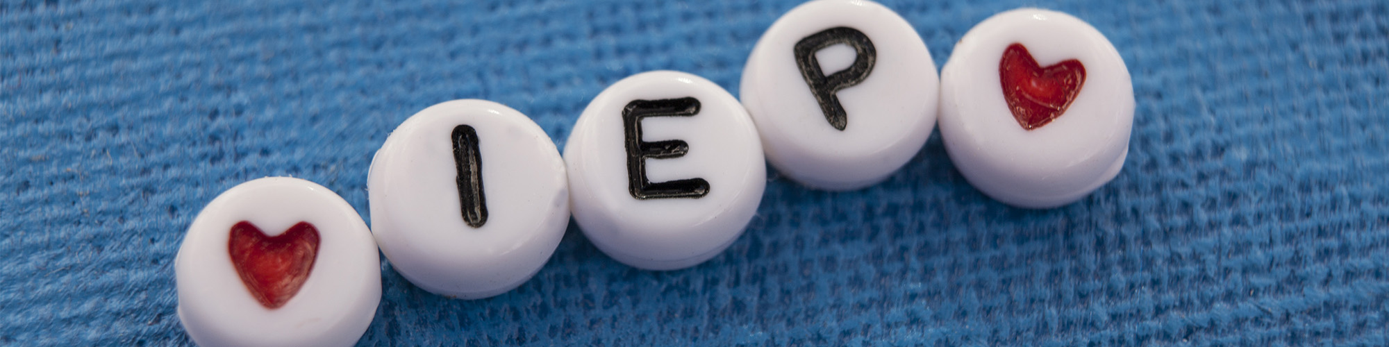 beads that spell IEP with hearts on the ends