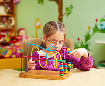 A student working with a bead board