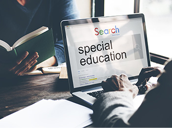 a person on a laptop searching for special education