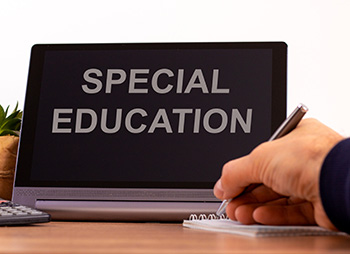 A laptop that has the words special education on the screen