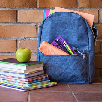 backpack and stack of books