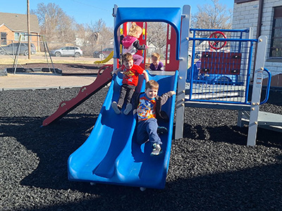 Children playing on the playground slide