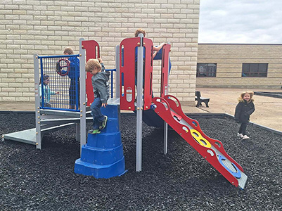 Children playing on playground equipment