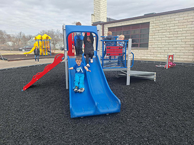 Children playing on playground equipment
