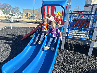Children playing on playground equipment