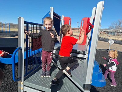 Children playing on playground equipment