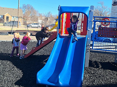 Children playing on playground equipment