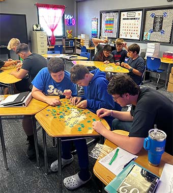 students working on a puzzle together