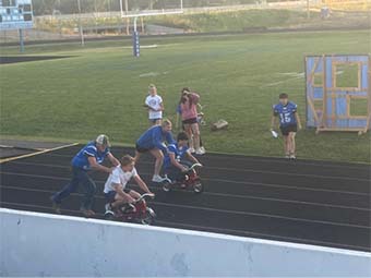 Students on tricycles