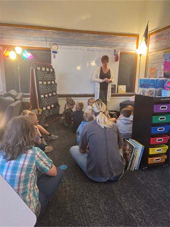 Students and staff sitting in class