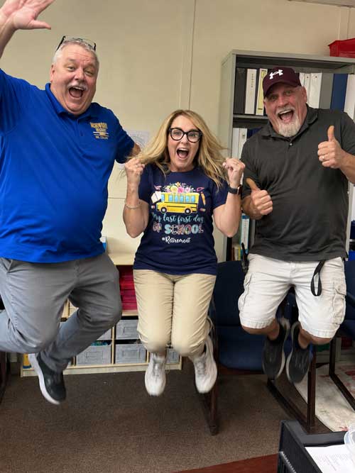 Lindell Conway, Sherry Souders, and Phil McCoy jumping for joy