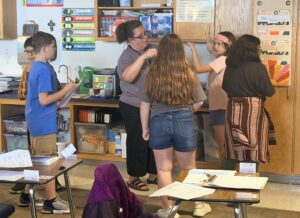 Students with colorful socks with the book Fox for Socks