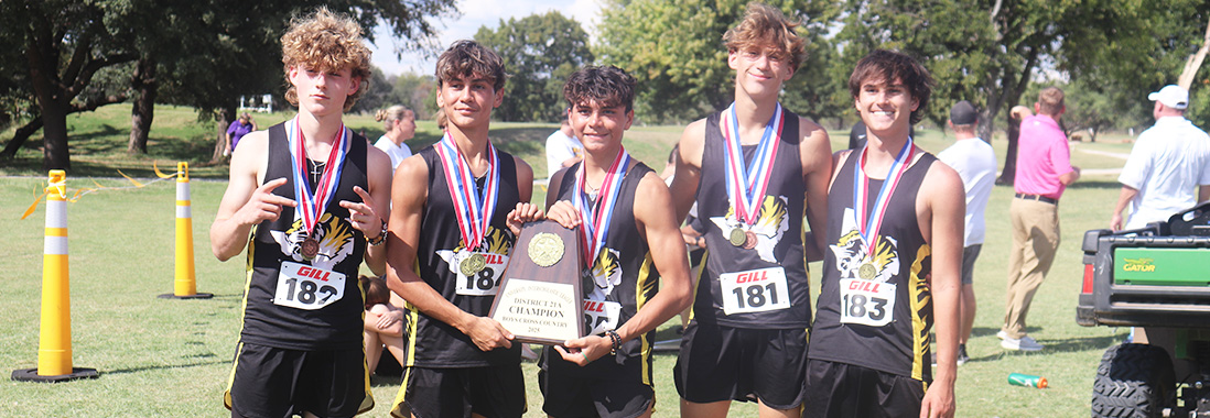 Boys cross country team proudly holding up a trophy